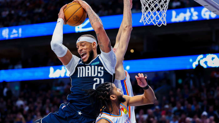 Mavericks Daniel Gafford grabs a rebound over Isaiah Joe against Oklahoma City